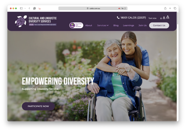 A young woman hugs an older woman in a wheelchair, both smiling in a garden. The website header reads Cultural and Linguistic Diversity Services. Text: Empowering Diversity—Supporting Disability Service.